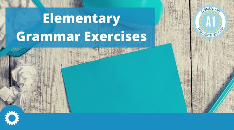 Blue desk with paper, pen, and stationery, featuring the text 'Elementary Grammar Exercises' and an A1 Elementary badge.
